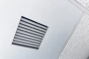 Closeup of clean metal ductwork in a modern air ventilation system related to mold growth and humidity